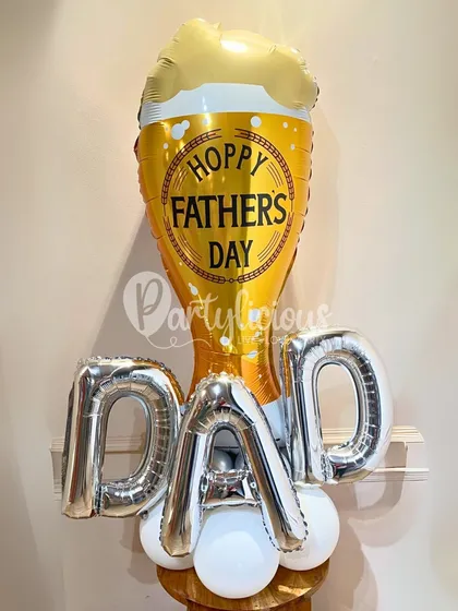 A "Hoppy Father's Day" for the dad who loves a good brew. This fun bouquet features a beer mug foil balloon and large "DAD" letters, making it a cheerful and lighthearted gift.