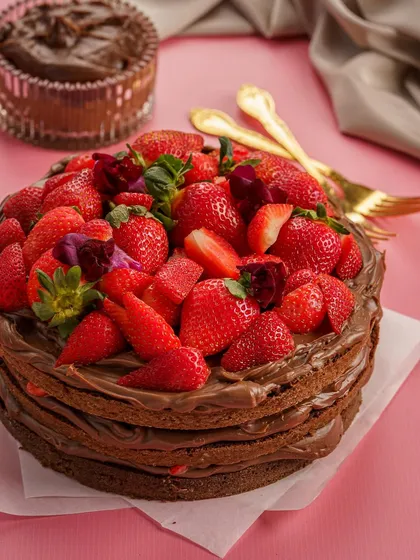 A layered Nutella and strawberry crepe cake is all about abundance. This photo captures the rustic, homemade feel while still looking incredibly delicious. The vibrant red of the strawberries against the rich brown of the Nutella is a classic, winning combination.