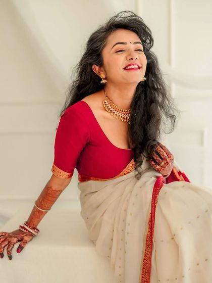 A radiant bridal portrait taken in our studio. The bride's joyful expression and carefree hair create a feeling of effortless beauty.