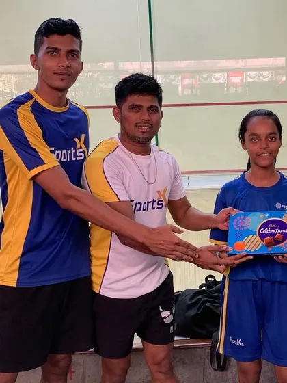 The runner-up of the Squash Star Academy tournament, Raksha Ningawale, is awarded her prize.