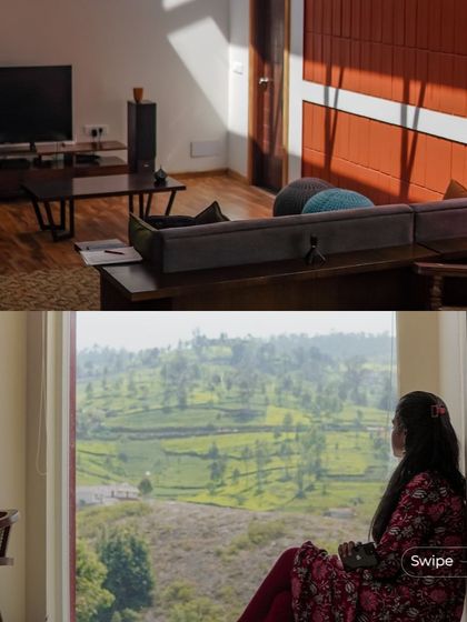 A duplicate of 145, this image captures a resident enjoying the view from a large window, showcasing the home's connection to the landscape.