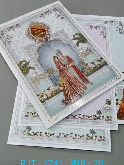 A simple and sweet card featuring a bride and groom in a garden setting. This affordable design comes with matching inserts and is perfect for a daytime wedding.