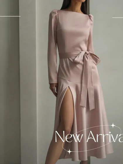 The Enzo dress is one of my signature designs, shown here in a beautiful dusty rose satin. It features elegant long sleeves, a boat neckline, and a tie-waist detail.