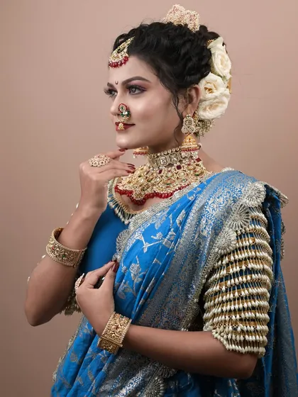 A profile view showcasing the beautiful hairstyle and the flawless makeup application.