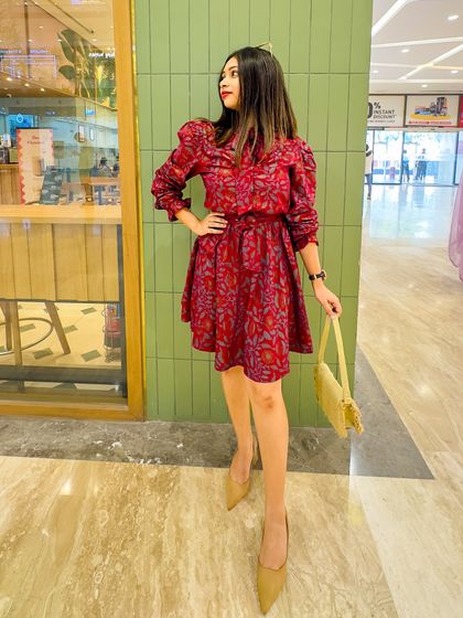 A full-length shot showing the complete outfit with the nude heels and woven bag.