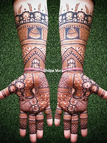 The full-arm bridal design against a green background, showing how it looks in natural light.