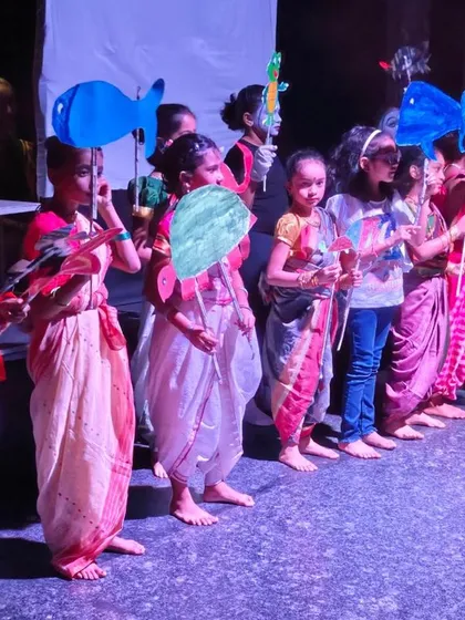 Our young performers line up with their handmade fish puppets for an under the sea themed scene. This shows how they learn to integrate prop work and performance, bringing their creative visions to life.