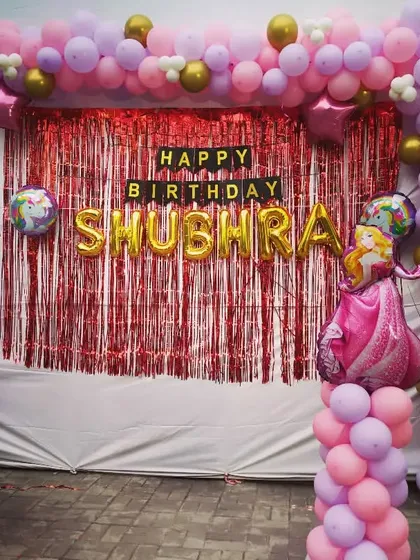 A glamorous Barbie and Unicorn theme birthday decoration. This setup combines pink and purple balloons with character foil balloons for a magical and stylish party.