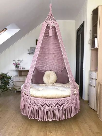 A baby pink swing that adds a soft and fragrant touch to your home. It's a comfortable and stylish piece that fits within your budget.