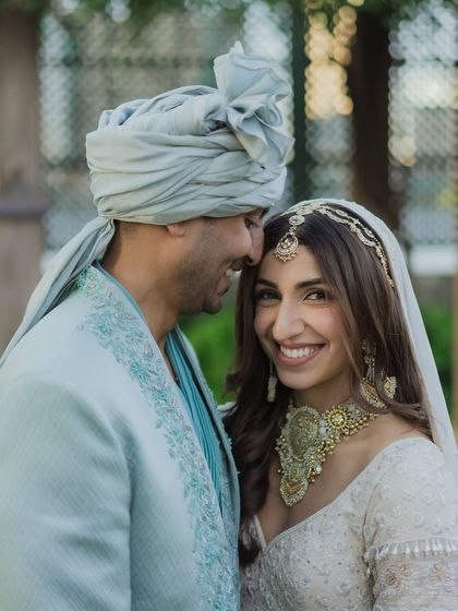 A happy, candid portrait of a couple sharing a moment of laughter. This image perfectly captures their joyful energy and the beautiful connection between them.