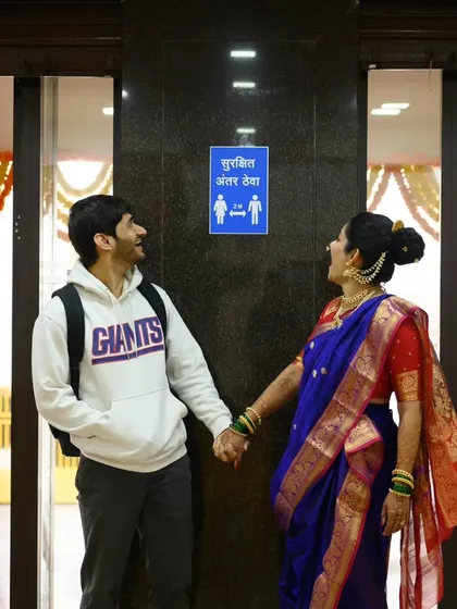 The story behind the funny photo. Here, Sanika and Shubhankar are just looking at each other and laughing at the absurdity of the situation. It’s a perfect memory from their wedding morning.