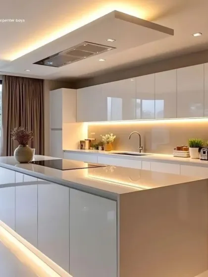 This all-white kitchen is the epitome of minimalism, featuring a large island with an integrated cooktop. We used handleless, high-gloss cabinets and subtle under-island lighting to create a seamless and spacious feel, perfect for an open-plan home.