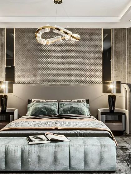 A truly luxurious bedroom with a textured, silver-paneled accent wall and a high-back upholstered bed. The sophisticated lighting and high-end finishes create an opulent and dramatic space.