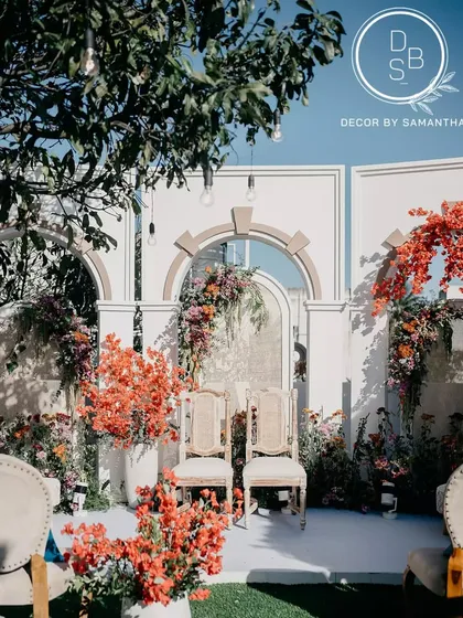 There's something incredibly special about a wedding at home. For this couple, we transformed their terrace into a breathtaking ceremony space filled with vibrant bougainvillea, telling a story of love that bloomed in a familiar place.
