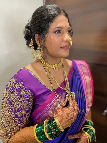 This bride chose a stunning violet Nauvari instead of the traditional yellow, and she looks absolutely radiant.