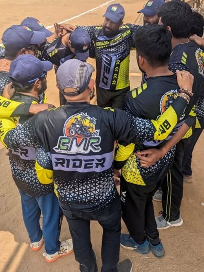 The BMR Cricket Team in a huddle. Our brotherhood isn't just on the road; we bring the same team spirit to the cricket pitch.