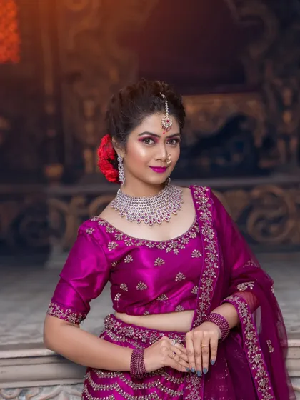 A full-length shot of the magenta lehenga, showing its rich color and embroidery.