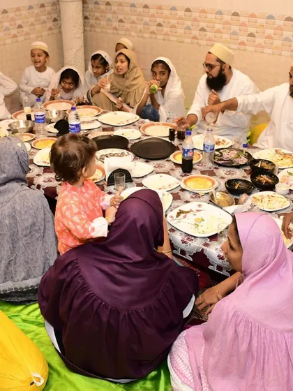 This is the essence of community dining. A family gathers for a meal around our traditional Bohra thal, sharing food and creating memories in our comfortable, air-conditioned banquet hall. We set up the dastarkhwan to make it feel just like home.