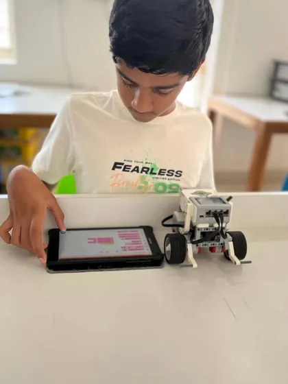 This student is testing the code for his wheeled robot. Our classes provide ample opportunity for students to experiment and see the immediate results of their programming.