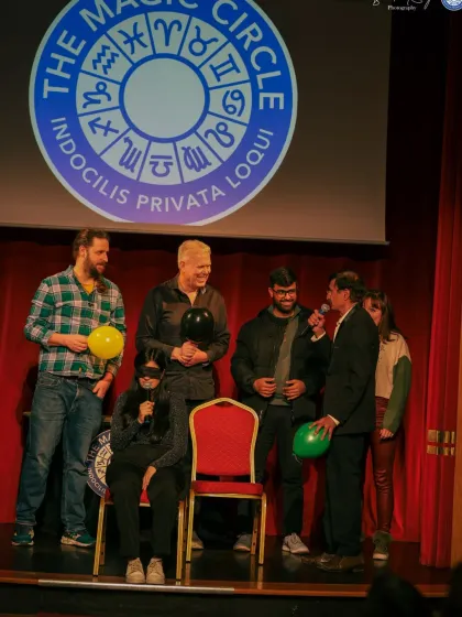 A great shot from my performance at The Magic Circle. Here you can see the audience volunteers on stage with me during my blindfold act, fully engaged in the mystery.
