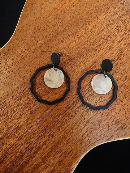 A flat-lay of the western black metal fashion drop earrings, featuring a unique geometric design.