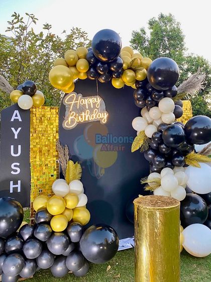 A detailed shot of the modern and chic 21st birthday balloon decor.