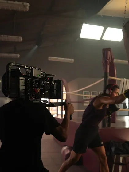 An ARRI SkyPanel X being used as an overhead soft light for a boxing scene. Its high-quality light output is perfect for capturing realistic skin tones.