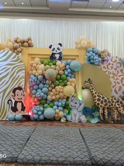 I love creating fun themes like this jungle safari stage decoration. With friendly animal cutouts like a lion, giraffe, and zebra, plus animal print backdrops and earthy-toned balloons, it’s a playful setup that gets everyone excited.