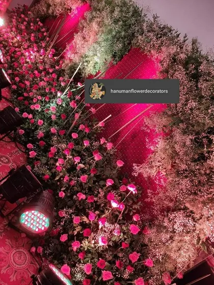A closer look at the texture and detail of the floral wall. We combine different types of flowers and foliage with focused lighting to create depth and visual interest for event decor.