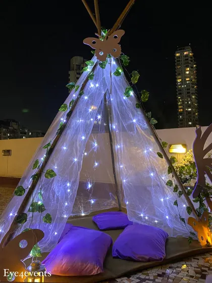 As part of the lavender birthday theme, we added this enchanting teepee tent. Adorned with fairy lights, ivy vines, and a butterfly motif, it served as a cozy and magical photo corner for the teens.
