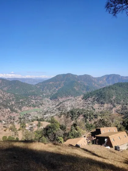 Perched on a ridge, our three guesthouses in northern Uttarakhand are sited to maximize views of the Panchachuli mountain range. The use of traditional thatch roofing helps the structures merge with the high-altitude landscape.