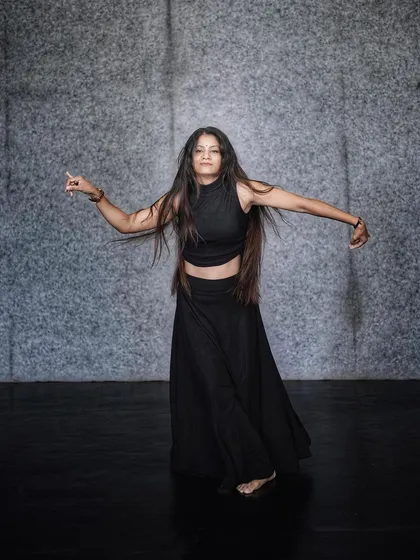 An open, expressive pose, inviting the viewer to feel the music and the movement with me.