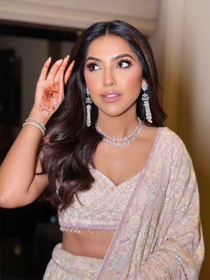 A candid moment showing how soft glam makeup looks beautiful from every angle. The focus is on radiant skin and softly enhanced features.