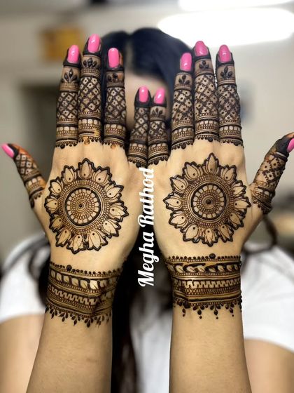 A classic sun-inspired mandala design on the palms, with detailed finger work, perfect for anyone who loves a bold centerpiece.