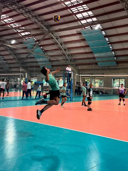 A Mintonette+ player demonstrates peak form with a powerful jump spike during a competitive match at an IIT Mumbai tournament. This is the level of performance our training aims to achieve.