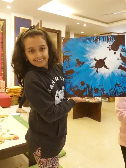 This student's version of the underwater scene includes a sea turtle and birds, creating a dynamic and imaginative composition.