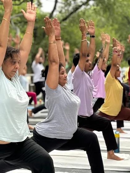 Feel the collective energy of our community practicing together outdoors. This image captures a moment from one of our group sessions, where students of all levels connect with their breath and movement under the open sky. We believe in the power of practicing together.