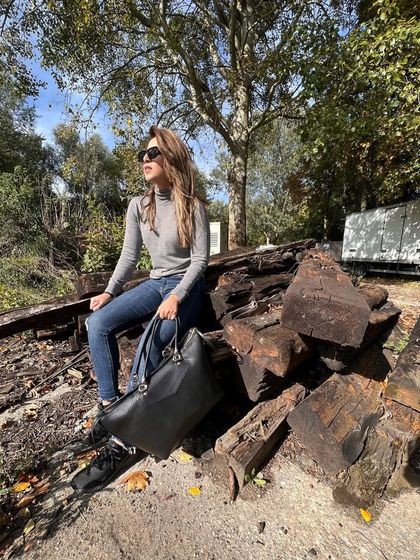 Taking a break on set. Even in a simple turtleneck and jeans, I always want to feel put-together.