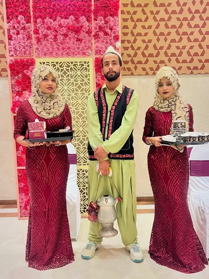 Our staff dressed in themed attire, including traditional Kashmiri outfits, to match the specific requirements and theme of a client's event.