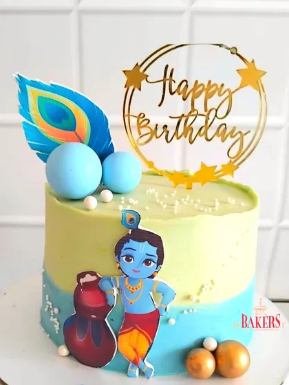 A super cute Krishna-themed cake for little Taksh’s 3rd birthday! This completely no-fondant cake features a charming illustration of Krishna, a peacock feather, and a pot of butter. The flavor was vanilla and mixed berries.