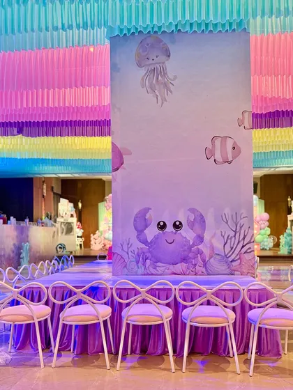 We set up dedicated activity stations for crayon making and tattoos, all themed with cute watercolor sea creatures to keep the little ones engaged and creative.