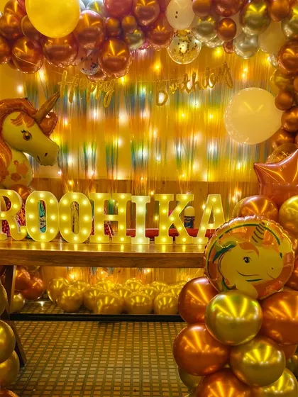 For Roohika's first birthday, I designed this stunning unicorn theme with a mix of chrome and metallic balloons. The light-up marquee letters add a personalized and glamorous touch.