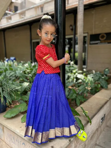 A final stylish pose. The blend of traditional dress and playful attitude perfectly represents the fun, modern approach we take to cultural dance.