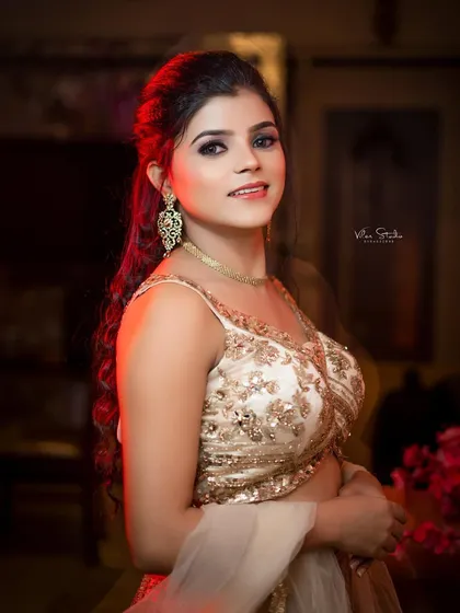 A striking bridal portrait with a pop of red backlight. This dramatic lighting technique makes the photo stand out and gives it a glamorous, high-fashion feel.