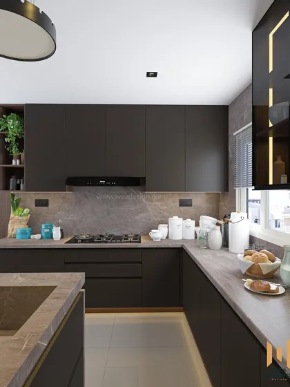 A view of the main cooking area, with a gas hob and ample counter space, all unified by the luxurious granite.