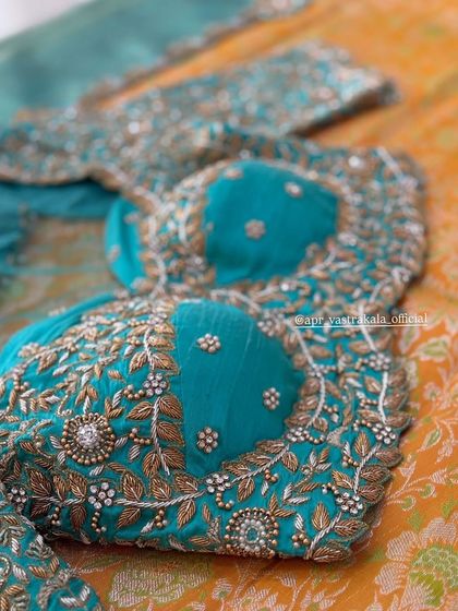 Another view of the turquoise leaf-motif blouse.