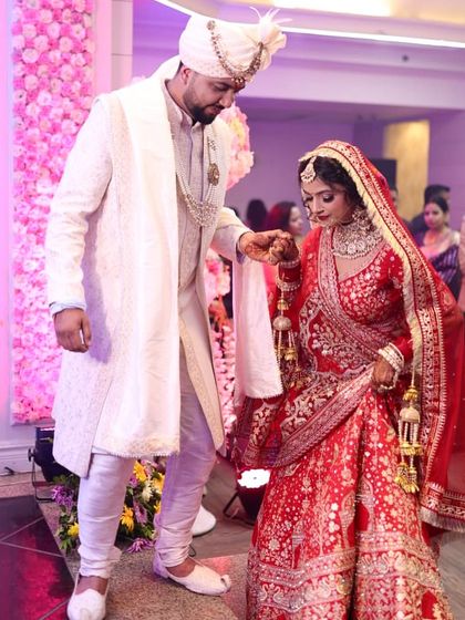 A sweet moment between the bride and groom during their entry. These are the memories that last a lifetime.