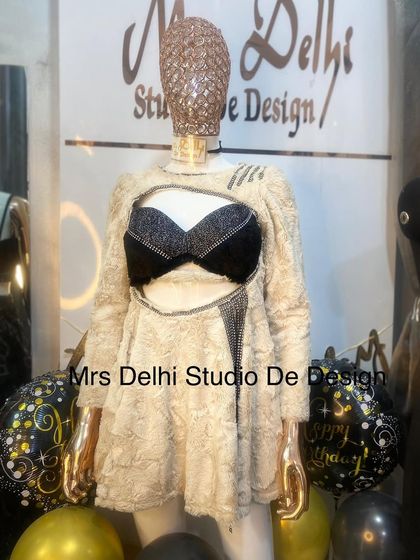 A close-up of the winter dress, highlighting the texture and the sparkling black bralette detail.