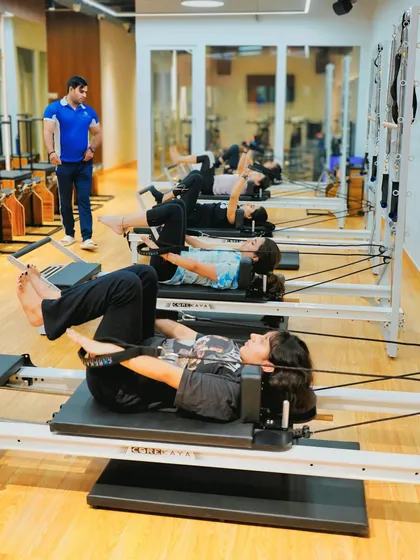 A typical group session where I'm always keeping an eye on everyone's form. You'll work on core exercises using the reformer, building strength and stability in a supportive class setting.