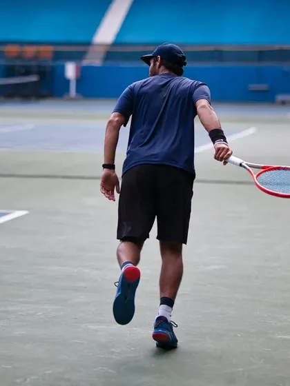 Walking onto the court with purpose. Every session starts with a clear goal, whether it's improving your serve or mastering your footwork.